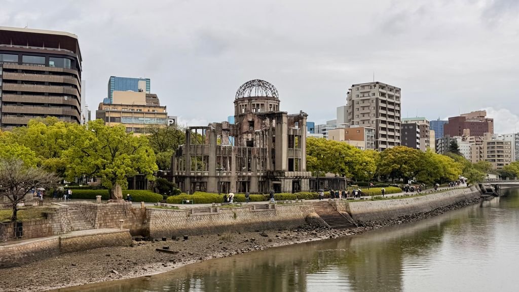 The iconic Hiroshima Peace Memorial stands resiliently along the river in Hiroshima, Japan.